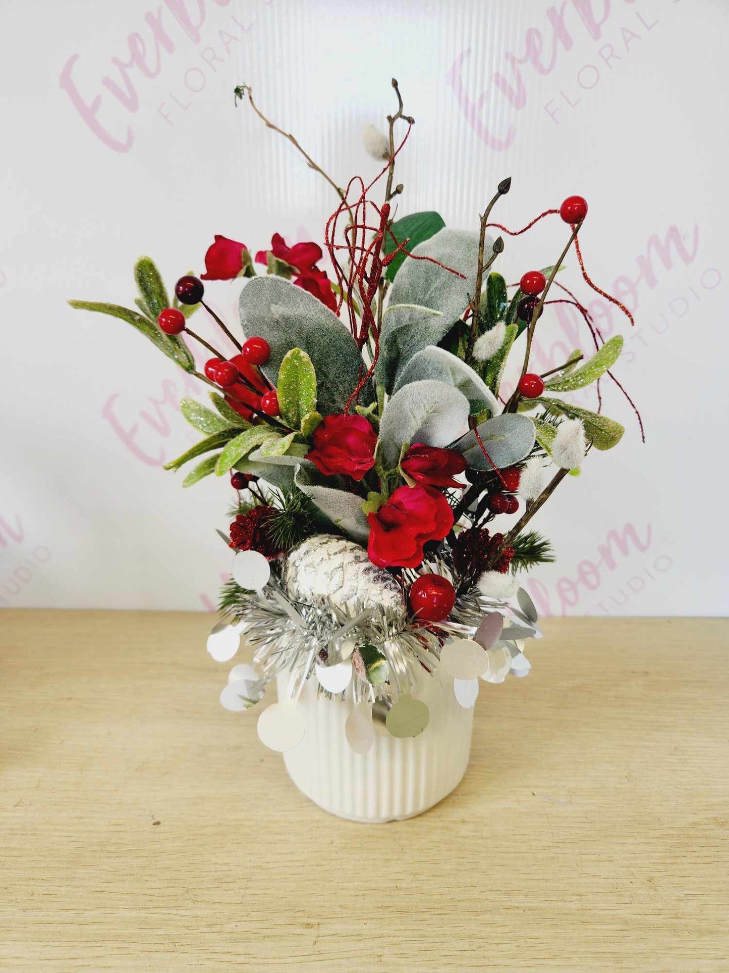 One of a kind Christmas Arrangement in a white ceramic pot, display on a side table in the entrance of your home or even decorate your table for Christmas family lunch.

If you can't make Christmas with that special someone send this gift to let them know you are thinking of them this Christmas

Made with a variety of Christmas decorations